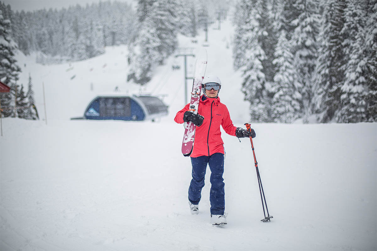 Women's ski boots (carrying skis at resort)